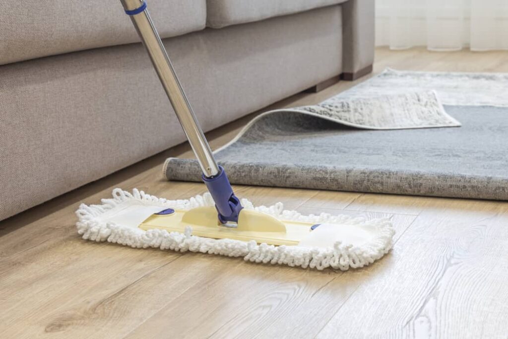 Cleaning a hardwood floor with a microfiber cloth keeps it from scratching.