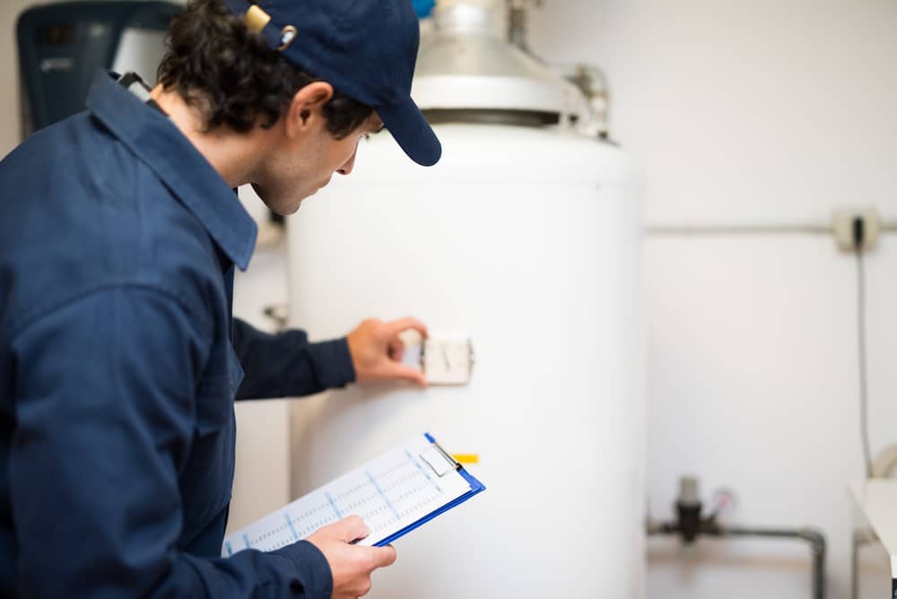 Adjusting the temperature on a water heater. 