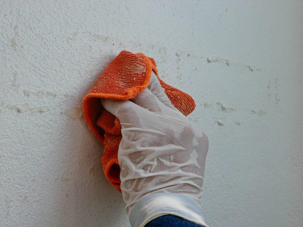 By using a cleaning solution or adhesive remover, you can get adhesive off of the walls. 