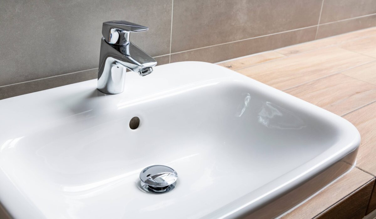 Drain stopper in bathroom sink can be removed if the drain is clogged or needs cleaning.