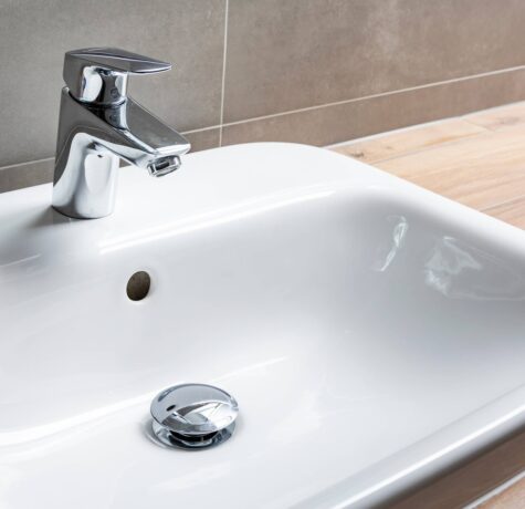 Drain stopper in bathroom sink can be removed if the drain is clogged or needs cleaning.