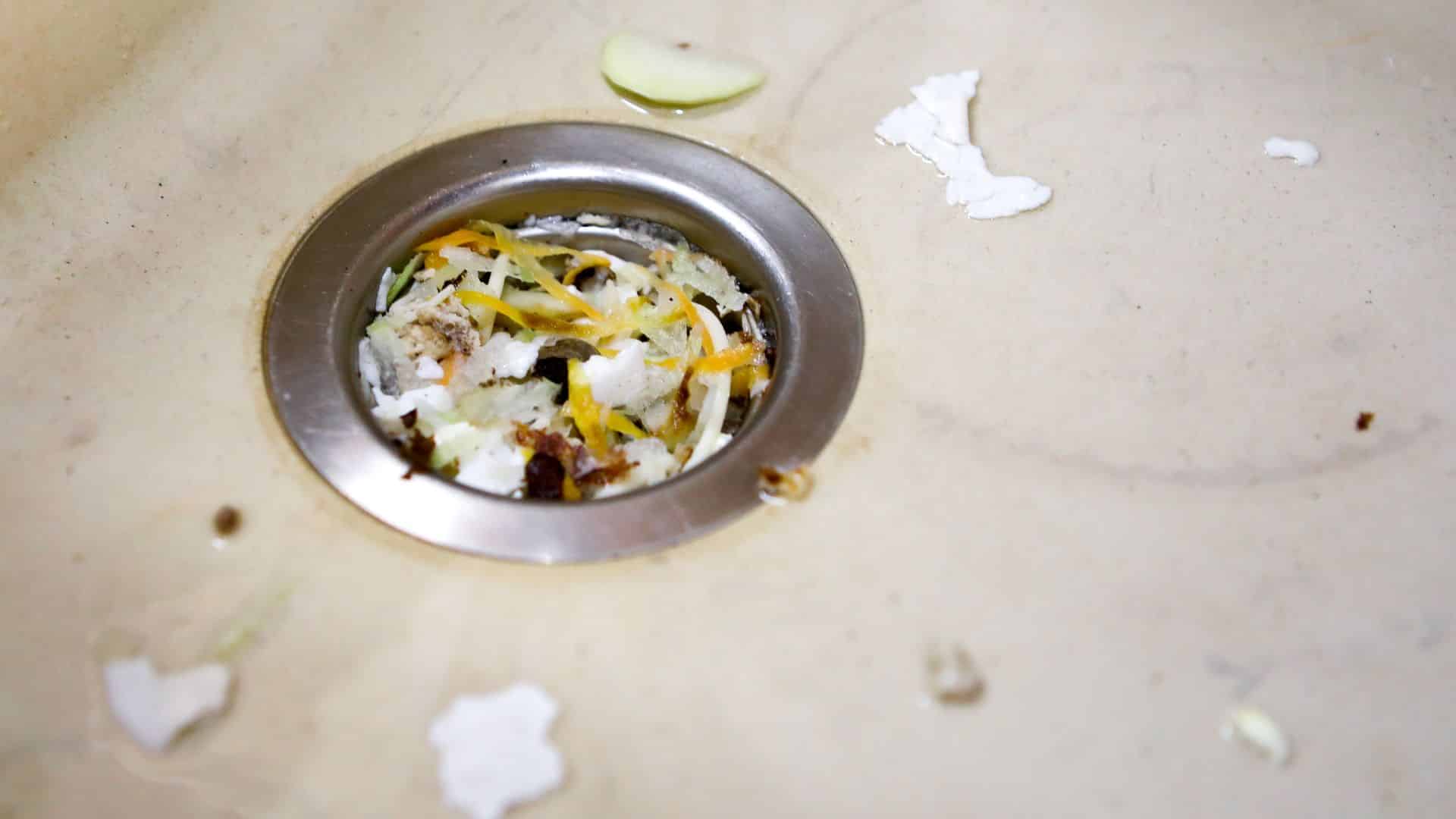 how to unclog a garbage disposal with standing water